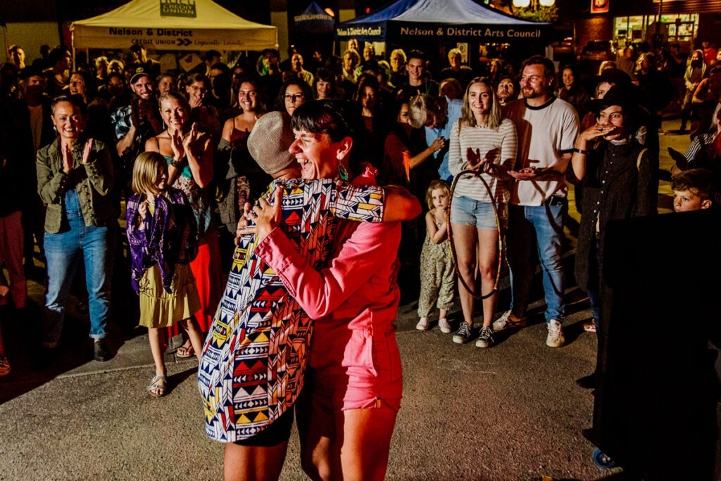 Amber Santos hugs a dancer at the festival