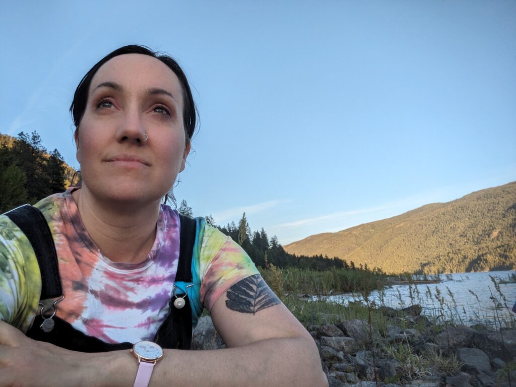 Gita Moore poses in front of a mountain range