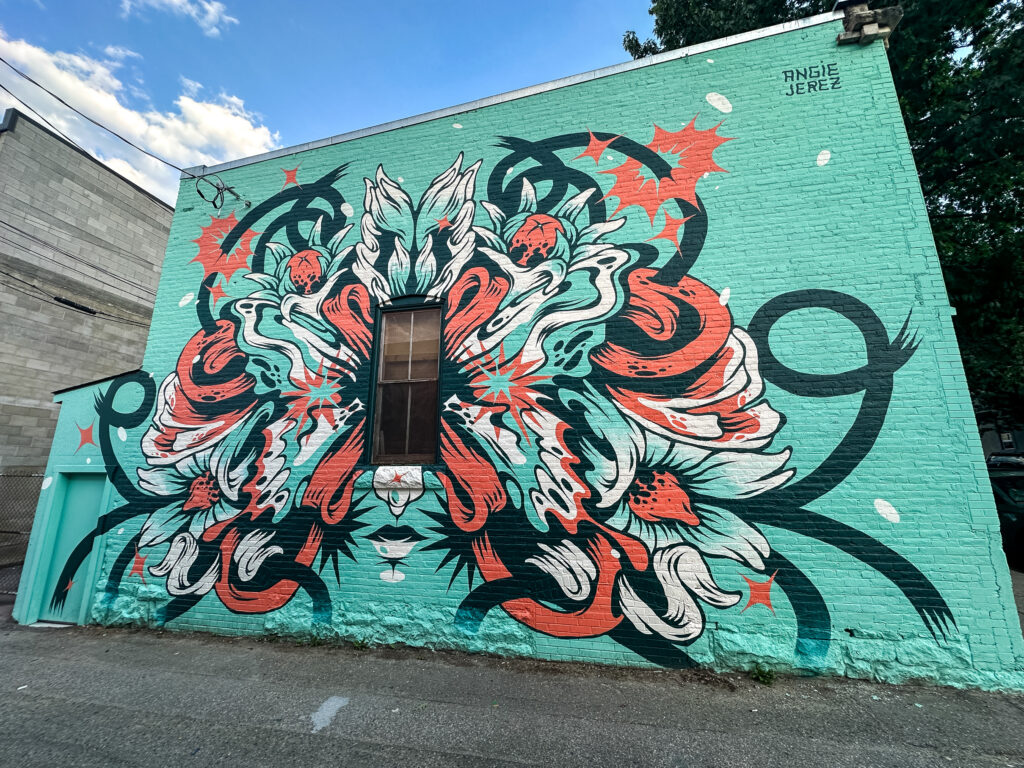 angie jerez painting with white headphones on